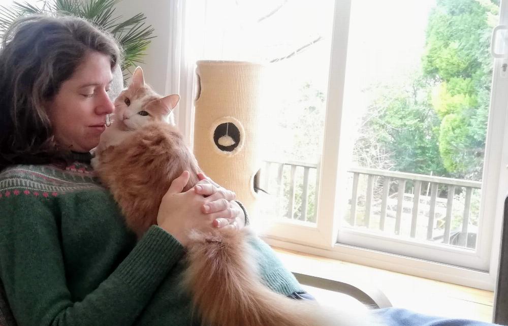 A photo of Joana holding Henry