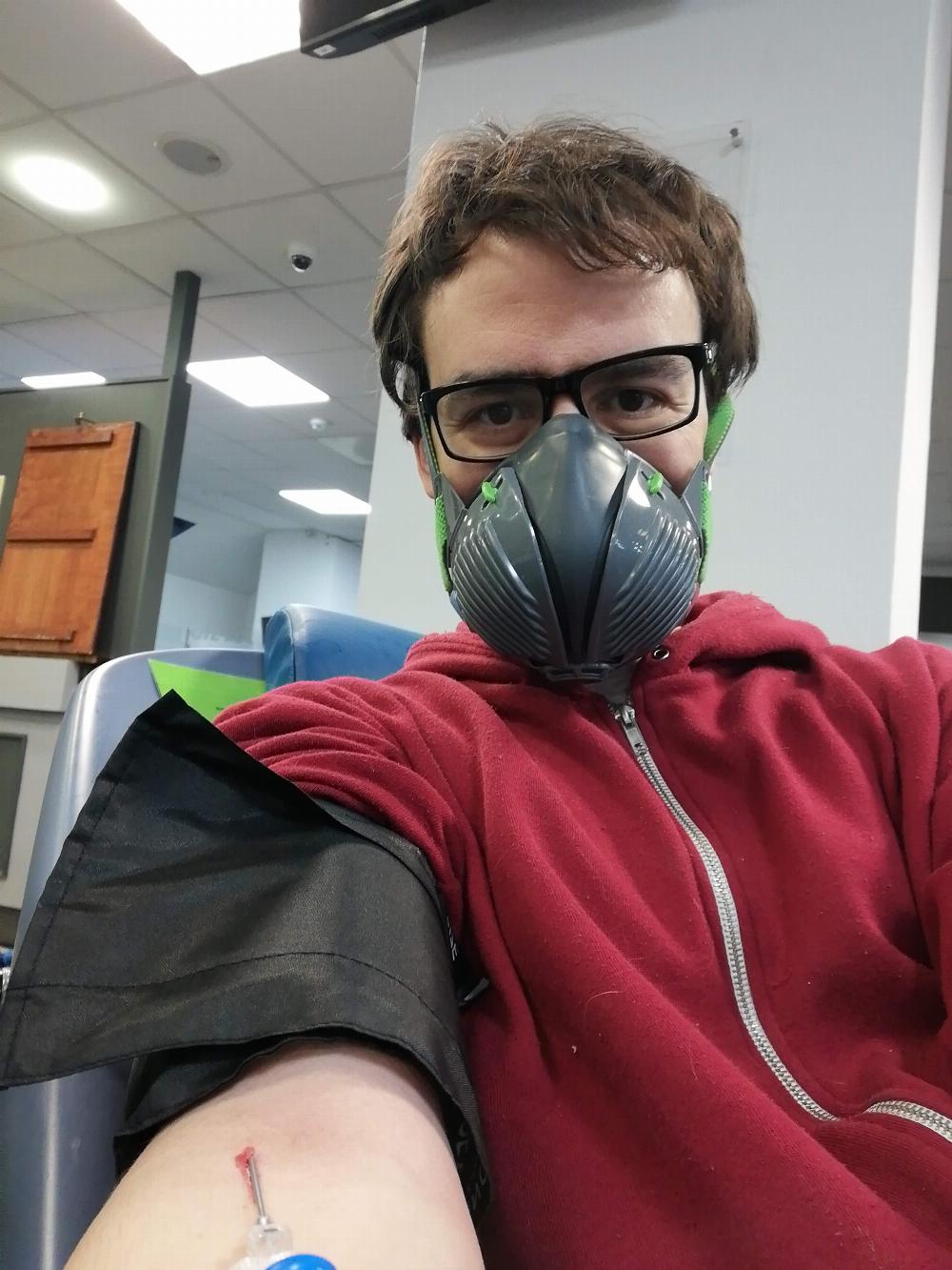 Me with face mask giving blood.
